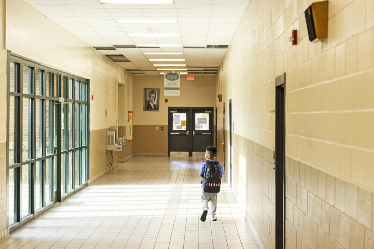 A student makes his down a hallway during summer school at Ida Green Elementary. (Brad Vest / for NBC News)