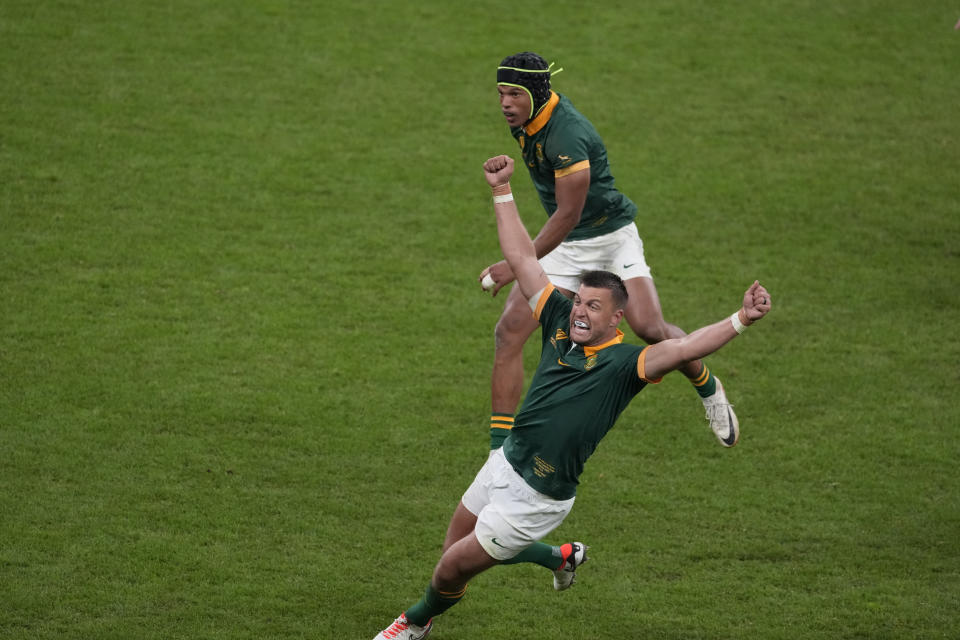 South Africa's Handre Pollard reacts after teammate Kurt-Lee Arendse kicked the ball out of play to end the Rugby World Cup quarterfinal match between France and South Africa at the Stade de France in Saint-Denis, near Paris, Sunday, Oct. 15, 2023. (AP Photo/Themba Hadebe)