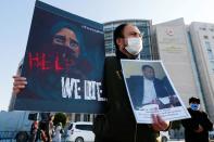 An ethnic Uyghur man takes part in a protest against China