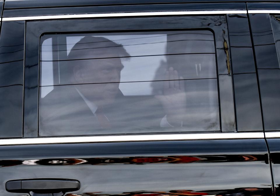 Former President Donald Trump waves to his supporters upon his arrival behind the Alto Lee Adams Sr. U.S. Courthouse along S 5th Street on Friday, March 1, 2024 in Fort Pierce for a hearing into his classified documents case.