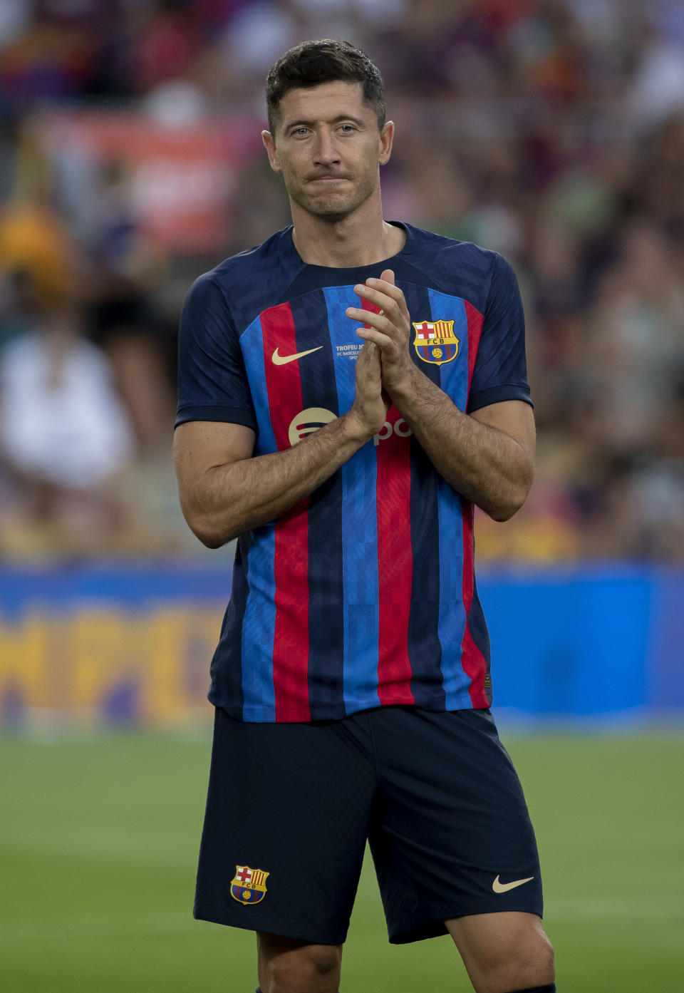 Barcelona's Robert Lewandowski claps to the crowd before the start of the Joan Gamper trophy soccer match between FC Barcelona and Pumas Unam at the Camp Nou Stadium in Barcelona, Spain, Sunday, Aug. 7, 2022. (AP Photo/Joan Monfort)