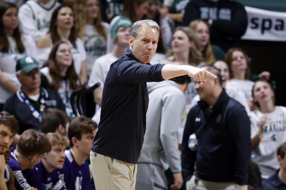 Northwestern coach Chris Collins gestures during the first half of an NCAA college basketball game against Michigan State, Wednesday, March 6, 2024, in East Lansing, Mich. (AP Photo/Al Goldis)