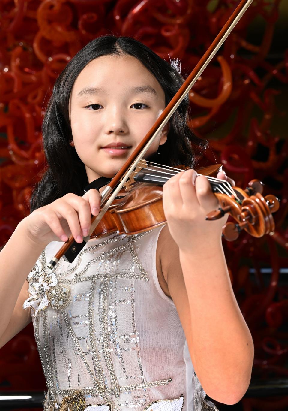 Deann Huang, violinist, poses for photos for the 2023 Salute to Youth Portraits at Abravanel Hall in Salt Lake City on Wednesday, Oct. 4, 2023. | Scott G Winterton, Deseret News