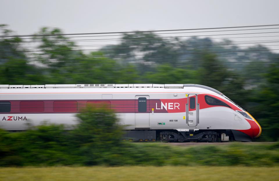 A London North Eastern Railway (LNER) Azuma train train passes through Sandy in Cambridgeshire