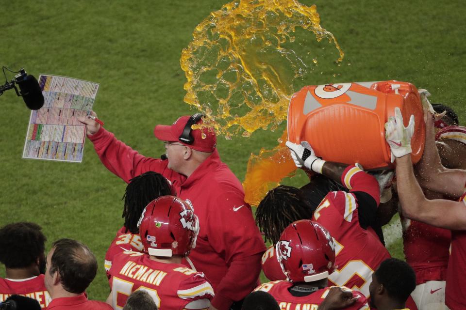 Kansas City Chiefs' players pour a cooler of Gatorade on head coach Andy Reid, during the second half of the NFL Super Bowl 54 football game against the San Francisco 49ers, Sunday, Feb. 2, 2020, in Miami Gardens, Fla. The Chiefs' defeated the 49ers 31-20. (AP Photo/Charlie Riedel)