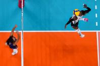 <p>Argentina's Erika Mercado spikes the ball in the women's preliminary round pool B volleyball match between Italy and Argentina during the Tokyo 2020 Olympic Games at Ariake Arena in Tokyo on July 29, 2021. (Photo by Antonin THUILLIER / AFP)</p> 