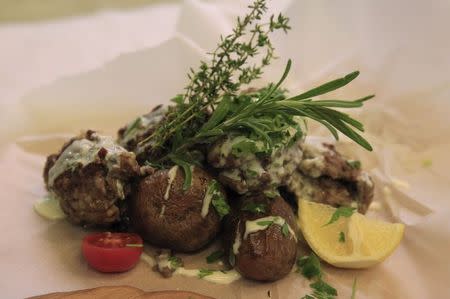 "Kibbeh", also known as Syrian meatballs, is served in the kitchen of the Castro restaurant in Budapest, Hungary, September 29, 2015. REUTERS/Bernadett Szabo