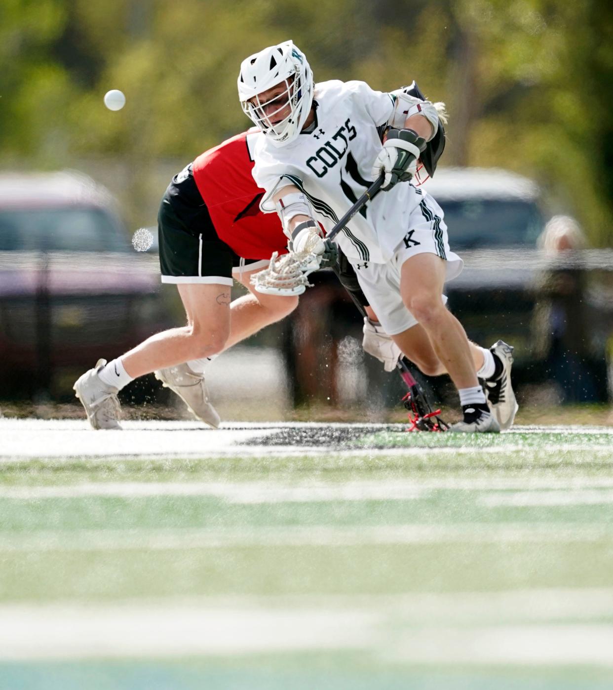 Kinnelon's Lex Lucas (11) wins a face-off against Morris Hills. in a lacrosse game in Kinnelon on Tuesday, April 25, 2023.