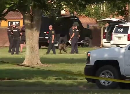 A police canine unit stands by in this still image taken from video following a shooting incident at the municipal center in Virginia Beach