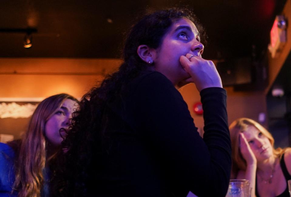 People attend a watch party for the first U.S. presidential debate hosted by CNN in Atlanta, at Union Pub on Capitol Hill in Washington, U.S., June 27, 2024. REUTERS/Nathan Howard