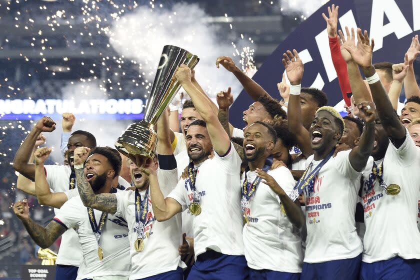 United States celebrate their extra-time victory over Mexico in the CONCACAF Gold Cup final soccer.