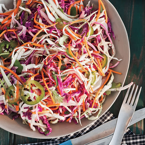 <p>This citrusy take on coleslaw is fresh and pleasantly spicy, an ideal side dish or burger or brat topping. Leave the seeds in more peppers for added fire, or seed all of them for a milder dish.</p> <p> <a rel="nofollow noopener" href="http://www.myrecipes.com/recipe/jalapeno-lime-slaw" target="_blank" data-ylk="slk:View Recipe: Jalapeño-Lime Slaw;elm:context_link;itc:0;sec:content-canvas" class="link ">View Recipe: Jalapeño-Lime Slaw</a></p>