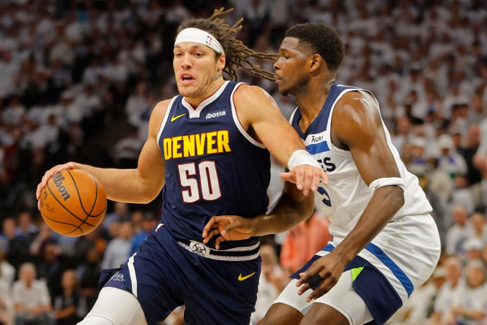 Denver Nuggets forward Aaron Gordon (50) works around Minnesota Timberwolves guard Anthony Edwards (5) in the first quarter of game four of the second round for the 2024 NBA playoffs at Target Center.