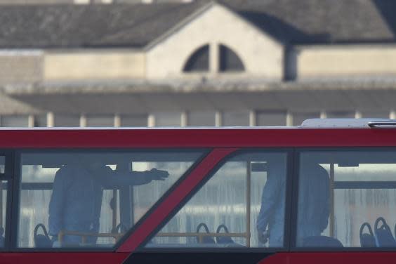 Forensic officers work on a bus as they investigate the scene of the stabbing (Peter Summers/Getty Images)