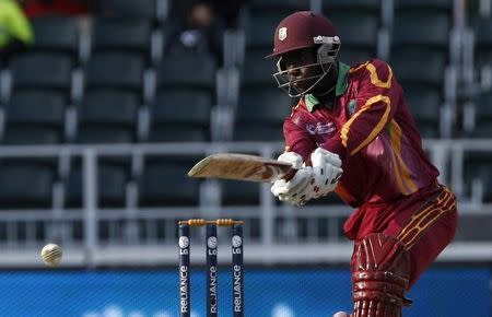 West Indies' Nikita Miller plays a shot during their ICC Champions Trophy cricket match against India in Johannesburg, September 30, 2009. REUTERS/Mike Hutchings