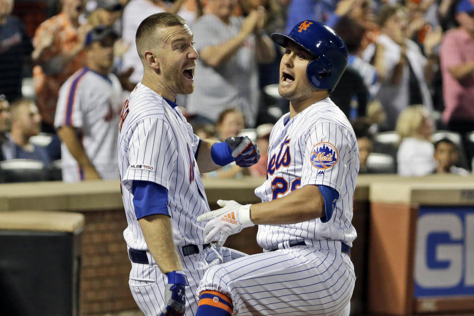 New York Mets' J.D. Davis, right, celebrates his solo home run with Todd Frazier during the fourth inning of a baseball game against the Washington Nationals, Saturday, Aug. 10, 2019, in New York. (AP Photo/Seth Wenig)