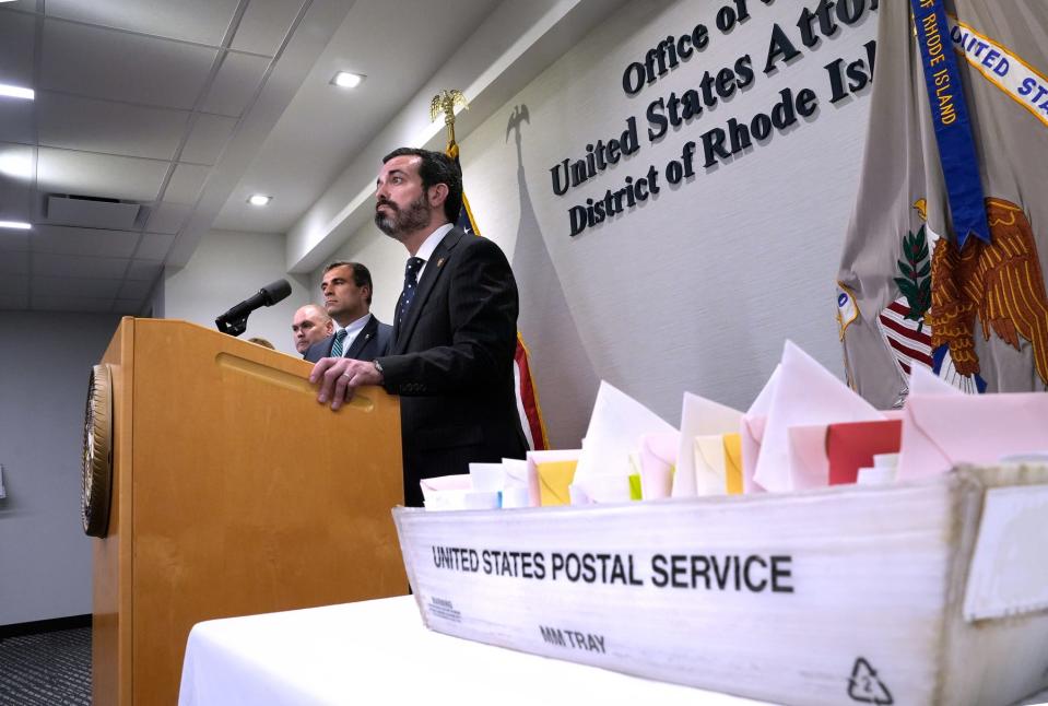 U.S. Attorney Zachary Cunha waits for questions in a news conference Wednesday about multiple arrests in a mail theft ring at the Providence postal processing and distribution center.