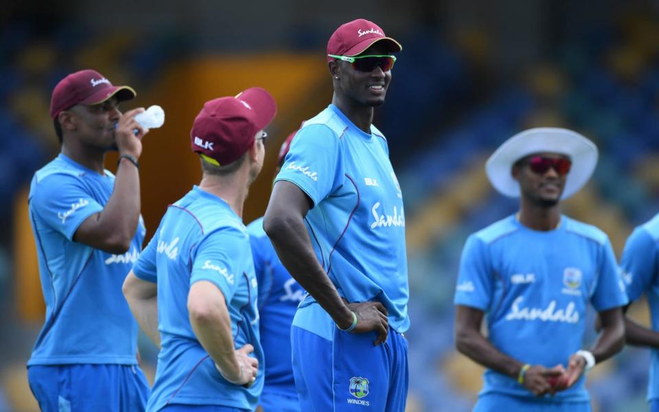 West Indies captain Jason Holder talks to his team-mates during net practice on the eve of the first Test against England - Getty Images Europe