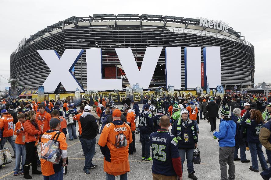 Fans arrive for the NFL Super Bowl XLVIII football game between the Seattle Seahawks and the Denver Broncos at MetLife Stadium Sunday, Feb. 2, 2014, in East Rutherford, N.J. (AP Photo/Seth Wenig)