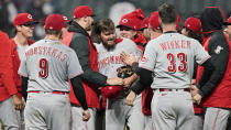 Cincinnati Reds starting pitcher Wade Miley, center, is congratulated by teammates after he pitched a no-hitter in a baseball game against the Cleveland Indians, Friday, May 7, 2021, in Cleveland. (AP Photo/Tony Dejak)