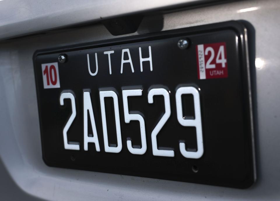 A Legacy license plate is pictured in Murray on Wednesday, Dec. 6, 2023. A bill by Sen. Lincoln Fillmore, R-South Jordan, introduced the retro black Utah license plates. This plate is a special group plate that benefits the Historical Society of Utah. | Laura Seitz, Deseret News