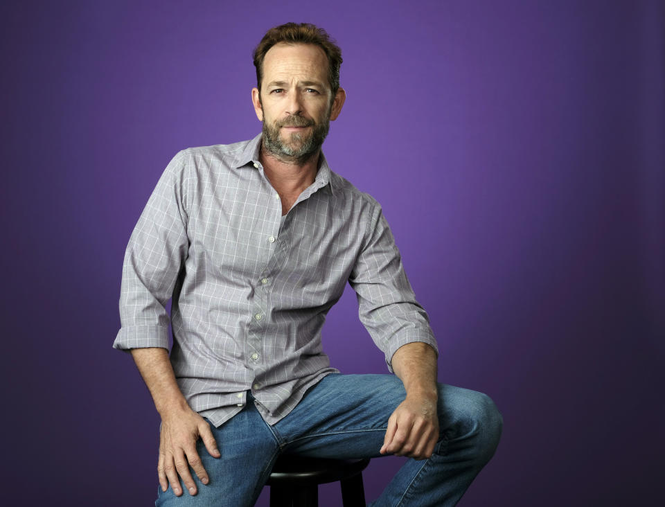 FILE - In this Aug. 6, 2018, file photo, Luke Perry poses for a portrait during the 2018 Television Critics Association Summer Press Tour in Beverly Hills, Calif. A publicist for Perry says the "Riverdale" and "Beverly Hills, 90210" star has died. He was 52. (Photo by Chris Pizzello/Invision/AP, File)