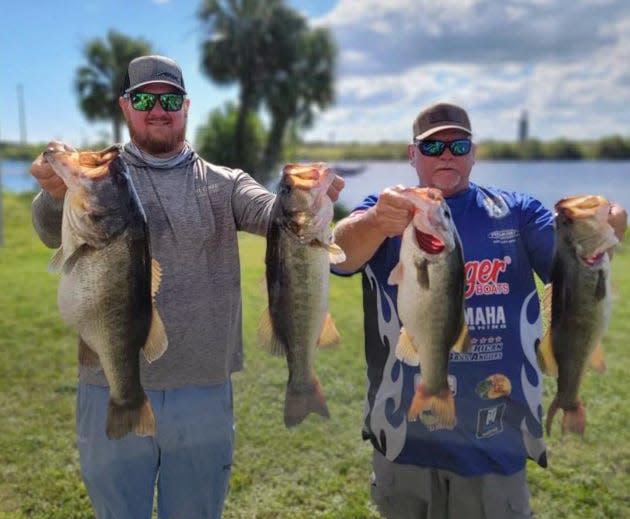 Austin Schroeder, left, took big bass with an 8.23 pounder to help him and his father Chad Schroeder to a total weight of 39.15 pounds and a first place finish in the Toho Marine-Bartow Ford Elite Pro Team Trail season ending classic on Oct. 22-23 on Lake Okeechobee. 