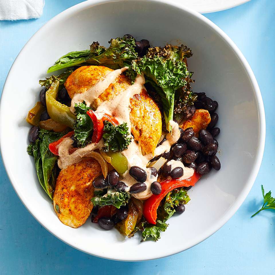 <p>Skip the tortillas in favor of this warm fajita salad, which features a nutritious medley of chicken with roasted kale, bell peppers and black beans. The chicken, beans and vegetables are all cooked on the same pan, so this healthy dinner is easy to make and the cleanup is easy too. <a href="https://www.eatingwell.com/recipe/274851/sheet-pan-chicken-fajita-bowls/" rel="nofollow noopener" target="_blank" data-ylk="slk:View Recipe;elm:context_link;itc:0;sec:content-canvas" class="link ">View Recipe</a></p>