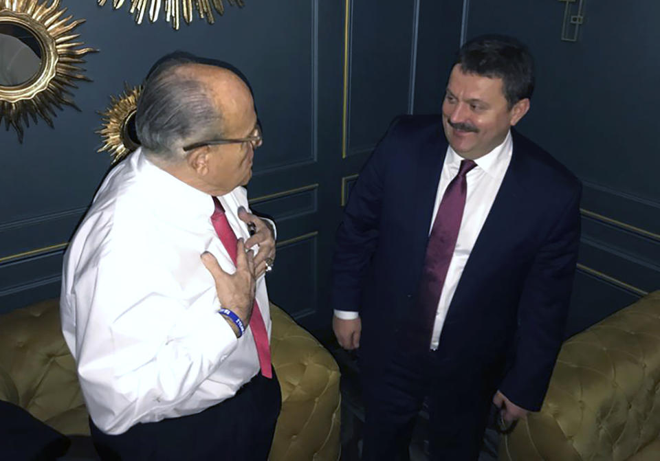 In this handout photo provided by Adriii Derkach's press office, Rudy Giuliani, an attorney for U.S President Donald Trump, left, meets with Ukrainian lawmaker Adriii Derkach in Kyiv, Ukraine, Thursday, Dec. 5, 2019. A Ukrainian lawmaker says he has met up with Rudy Giuliani, President Donald Trump’s personal attorney, in Kyiv to discuss an anti-corruption project. Derkach, who has previously accused the son of former Vice President Joe Biden of embezzling money from a gas company in Ukraine, posted photos of Thursday’s meeting on his Facebook page. (Adriii Derkach's press office via AP)