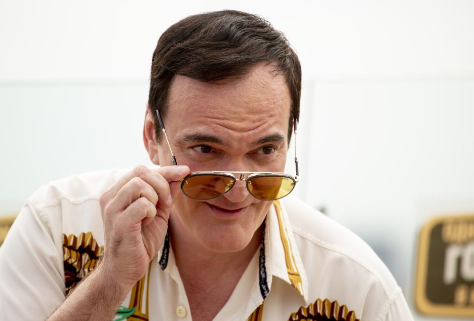 American writer and film director Quentin Tarantino pose for photographers prior to the premiere of the movie 'Once Upon A Time in Hollywood' in Moscow, Russia, Wednesday, Aug. 7, 2019. (AP Photo/Alexander Zemlianichenko)