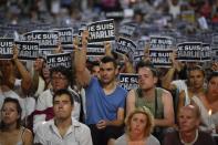 Members of Sydney's French community gather in the heart of the city to pay tribute to the victims of the Paris shooting