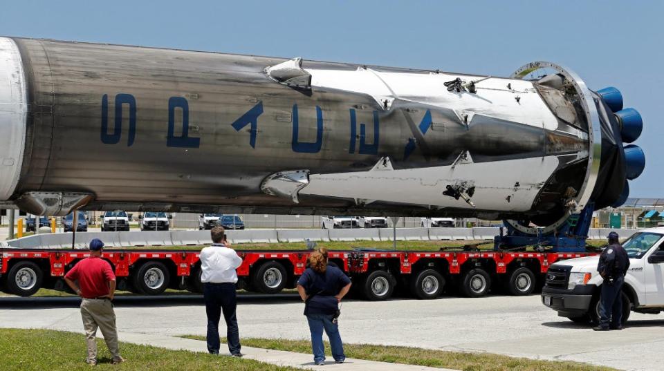 The recovered first stage of a SpaceX Falcon 9 rocket is transported to the SpaceX hangar at launch pad 39A at the Kennedy Space Center in Cape Canaveral, Florida May 14, 2016 (REUTERS/Joe Skipper)