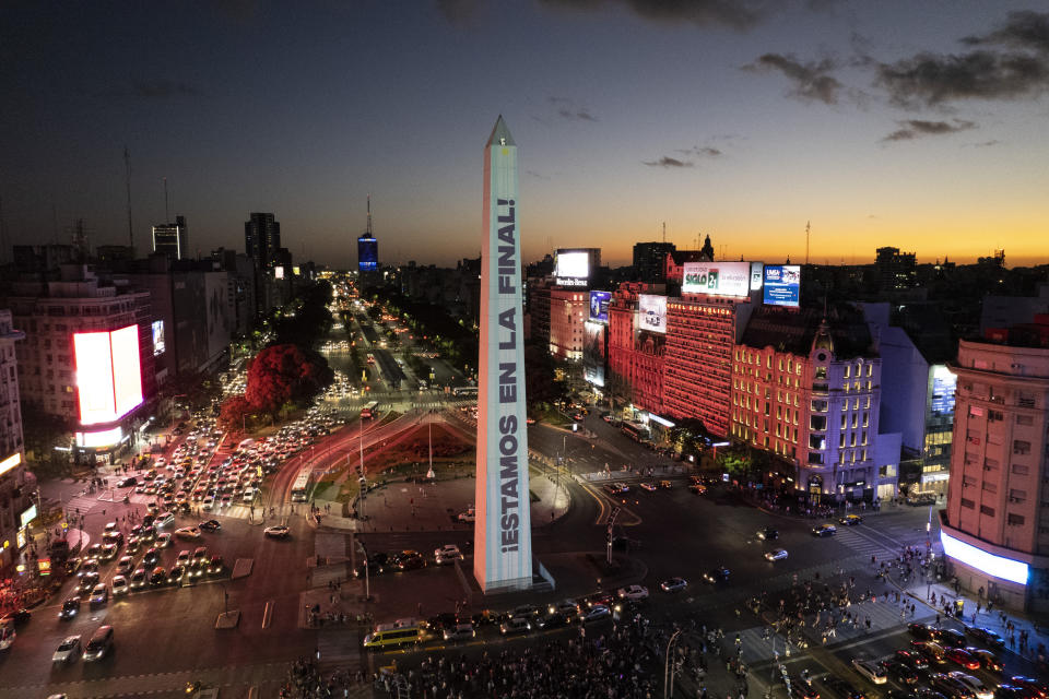 The Obelisk landmark is illuminated with a message that reads in Spanish: "We are in the final," in Buenos Aires, Argentina, Saturday, Dec. 17, 2022, during a rally in support of the national soccer team a day ahead of the World Cup final against France. (AP Photo/Rodrigo Abd)