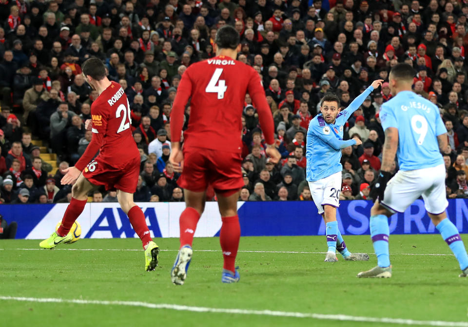 Manchester City's Bernardo Silva (centre right) scores his side's first goal of the game during the Premier League match at Anfield, Liverpool. (Photo by Peter Byrne/PA Images via Getty Images)