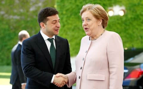 German Chancellor Merkel and Ukrainian President Zelenskiy at the Chancellery in Berlin - Credit: REUTERS