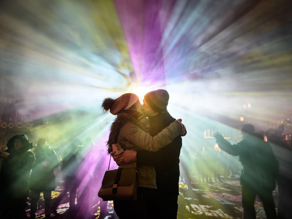 couple kissing at a festival