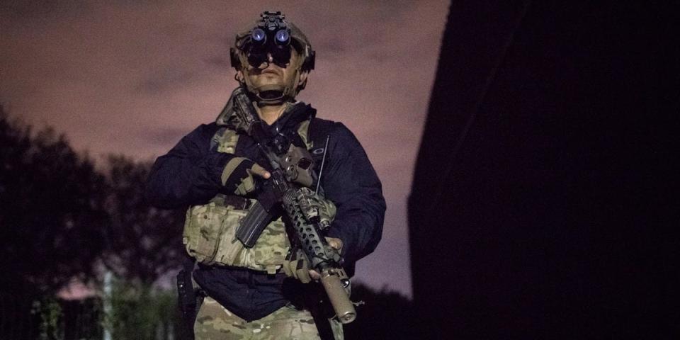 Agent Alex Suarez with the U.S. Border Patrol Tactical Unit (BORTAC) guards the U.S. side of the border wall with Mexico in Brownsville, Texas, U.S. October 17, 2018.