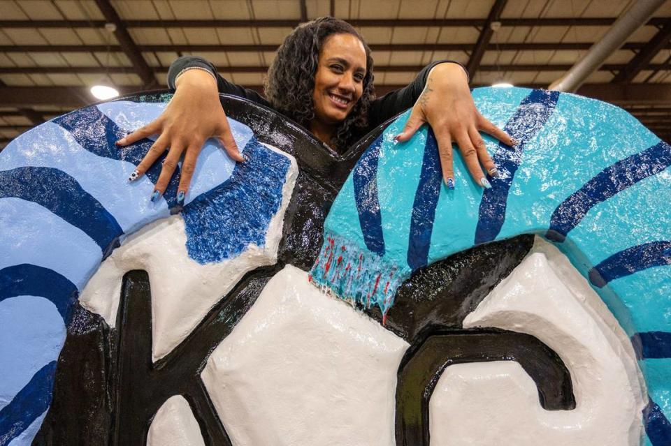 Artist Kirsten Mims displays her themed nails matching her heart display titled “Kicking it in KC” during the Parade of Hearts reveal kickoff event at the American Royal Hale Arena on Friday, April 12, 2024, in Kansas City. Emily Curiel/ecuriel@kcstar.com