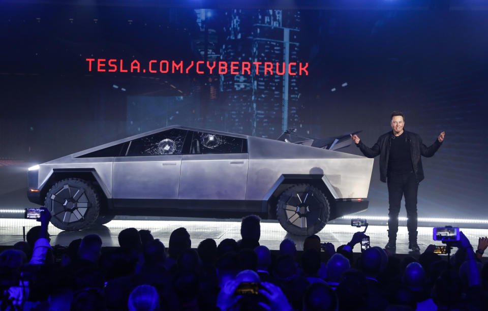 File - Tesla CEO Elon Musk introduces the Cybertruck at Tesla's design studio on Nov. 21, 2019, in Hawthorne, Calif. The windows were broken during a demonstration intended to show the strength of the glass. Musk is expected to give an update on manufacturing problems with the long-awaited Cybertruck at an event Thursday marking the first deliveries of the futuristic, angular pickup truck. (AP Photo/Ringo H.W. Chiu)