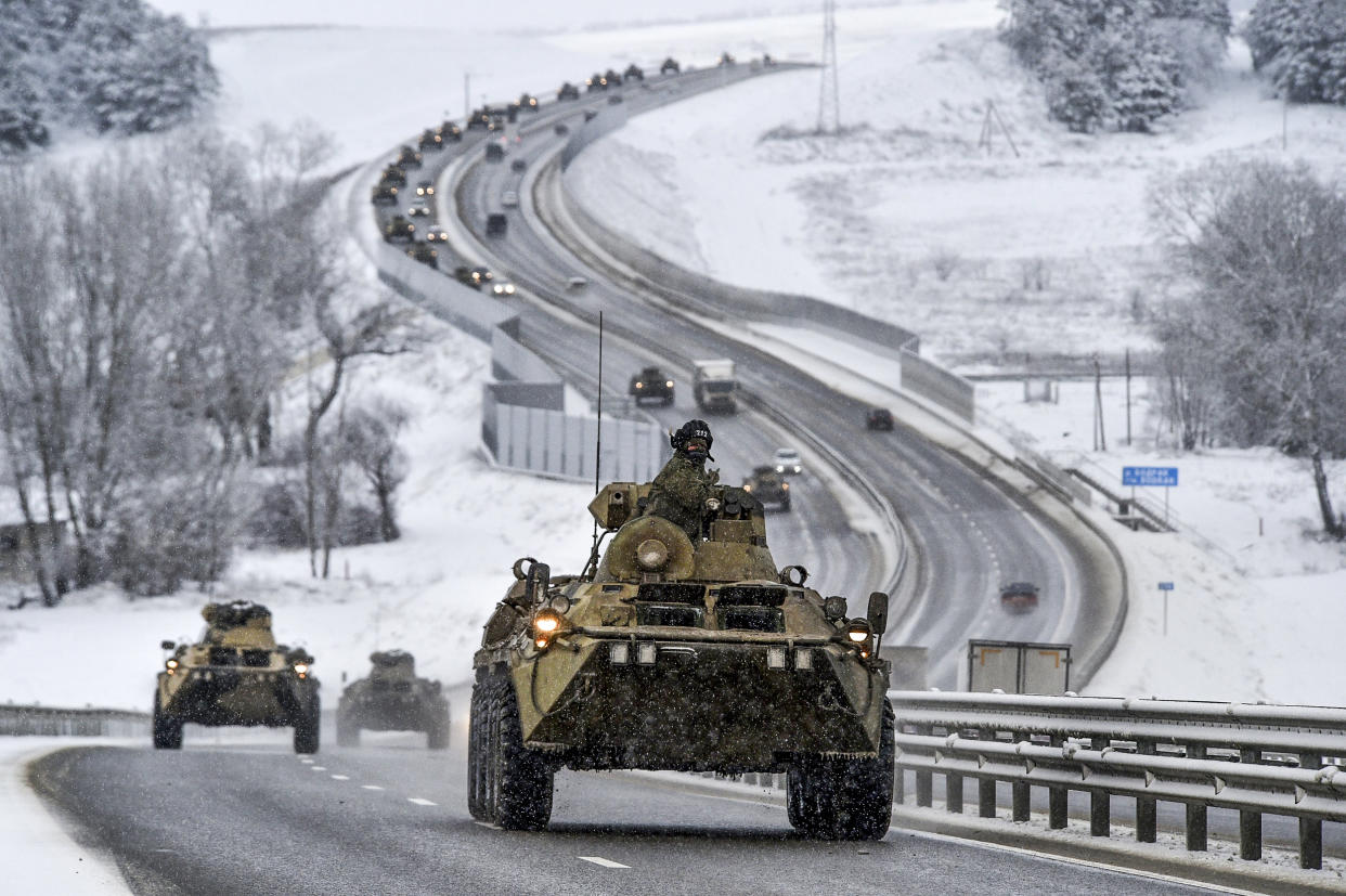 Image: A convoy of Russian armored vehicles moves along a highway in Crimea on Jan. 18, 2022. (AP)