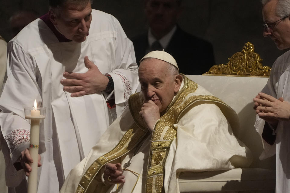 Pope Francis presides over an Easter vigil ceremony in St. Peter's Basilica at the Vatican, Saturday, April 8, 2023. (AP Photo/Gregorio Borgia)