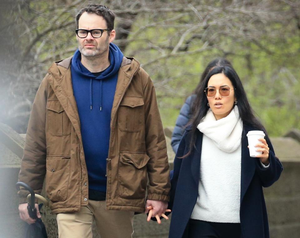 Closeup of Bill Hader and Ali Wong walking outside