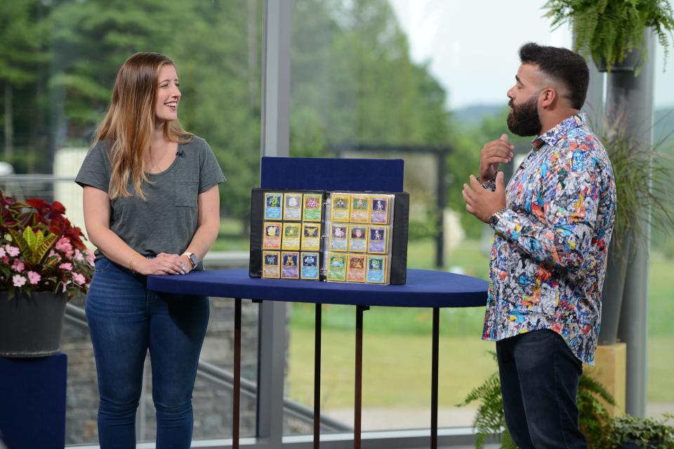 Appraiser Travis Landry discusses a collection of Pokemon cards during the "Antiques Roadshow" season 27 tour at the Shelburne Museum on July 12, 2022.