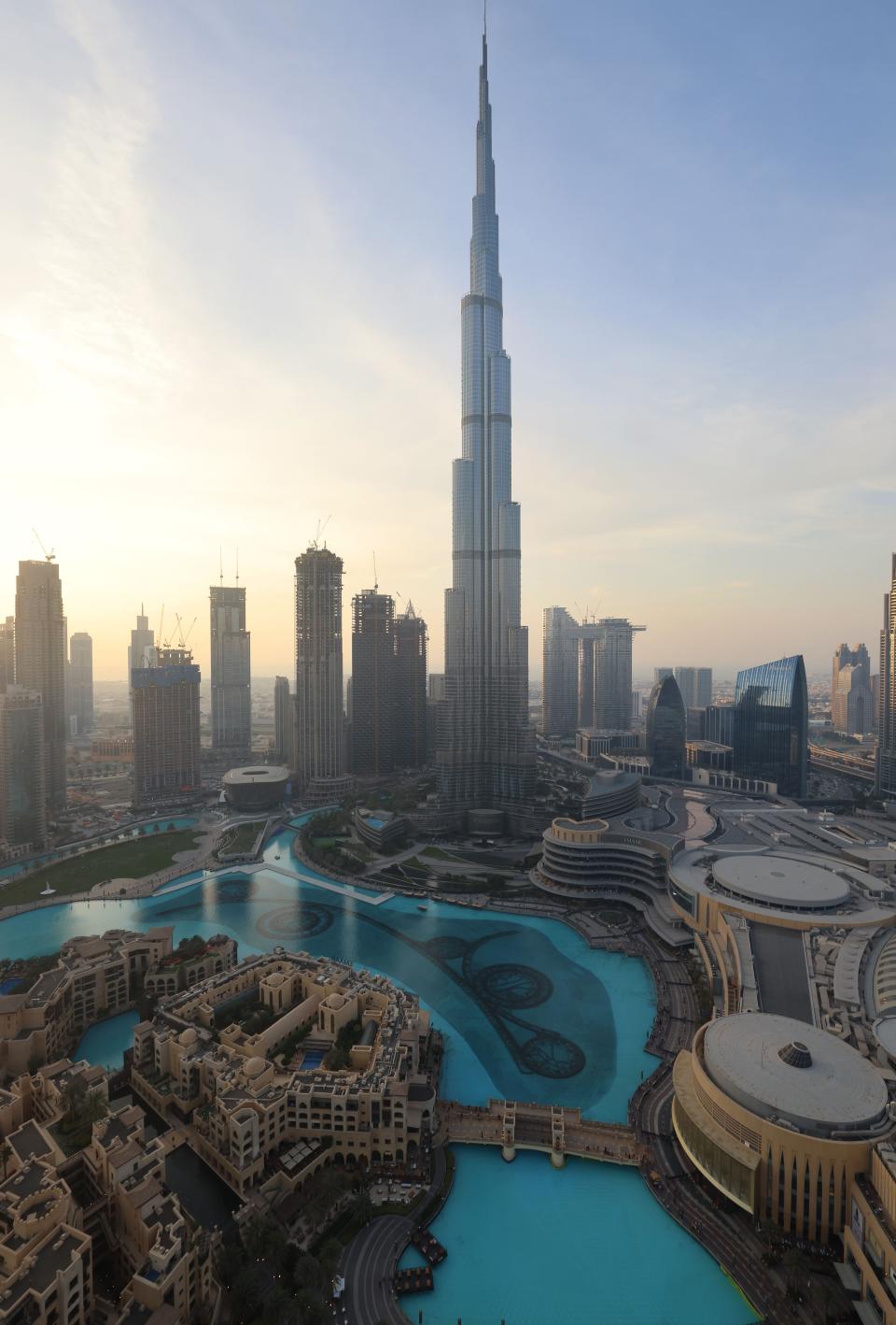 The Burj Khalifa towers over Dubai's skyline at sunset on February 9, 2021.