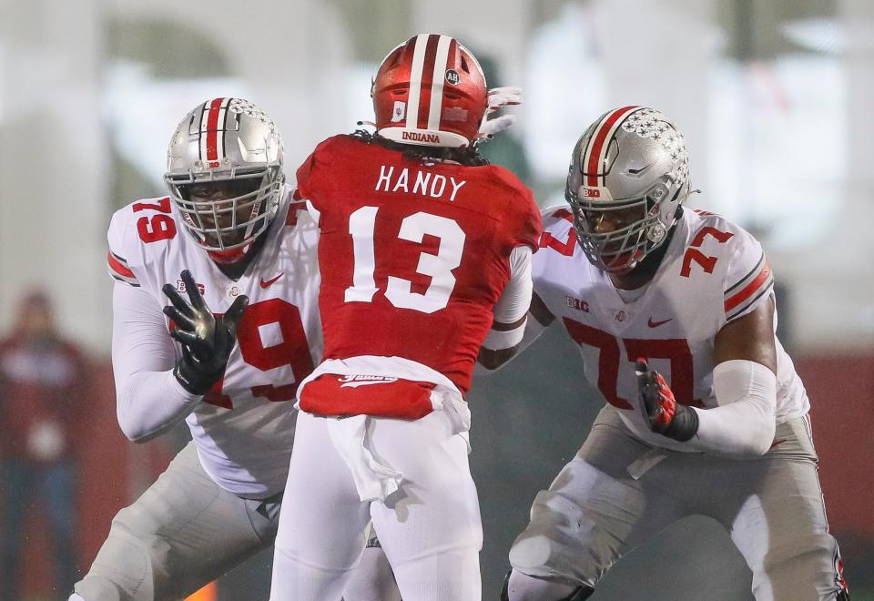 When Paris Johnson (77) isn't blocking for Ohio State quarterback C.J. Stroud, the sophomore is writing his own sports stories, or he is learning how to speak Portuguese and salsa and samba.