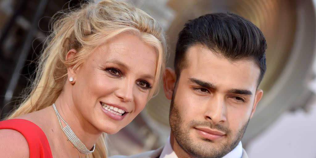 britney spears and sam asghari looking into the camera