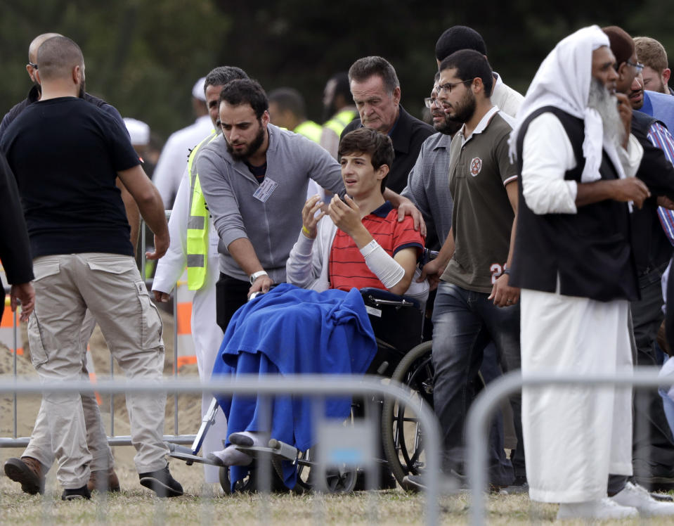 Zaed Mustafa, in wheelchair, arrives at Memorial Park to farwell his loved ones who were killed in the massacre. Source: AP