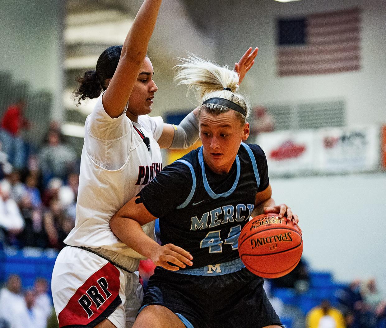 Mercy's Leah Macy (44) posted up against PRP's Breanna Jones (32) during the 6th Region Girls semifinal at Valley High School. The Mercy Jaguars defeated the PRP Panthers, 75-44. March 3, 2022