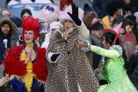 Harvard's Hasty Pudding Theatricals Woman of the Year Jennifer Coolidge, center, rides in a parade in her honor, Saturday, Feb. 4, 2023, in Cambridge, Mass. (AP Photo/Michael Dwyer)