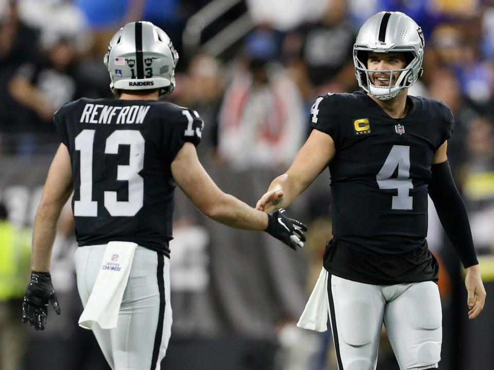 Derek Carr and Hunter Renfrow celebrate a play against the Los Angeles Chargers.